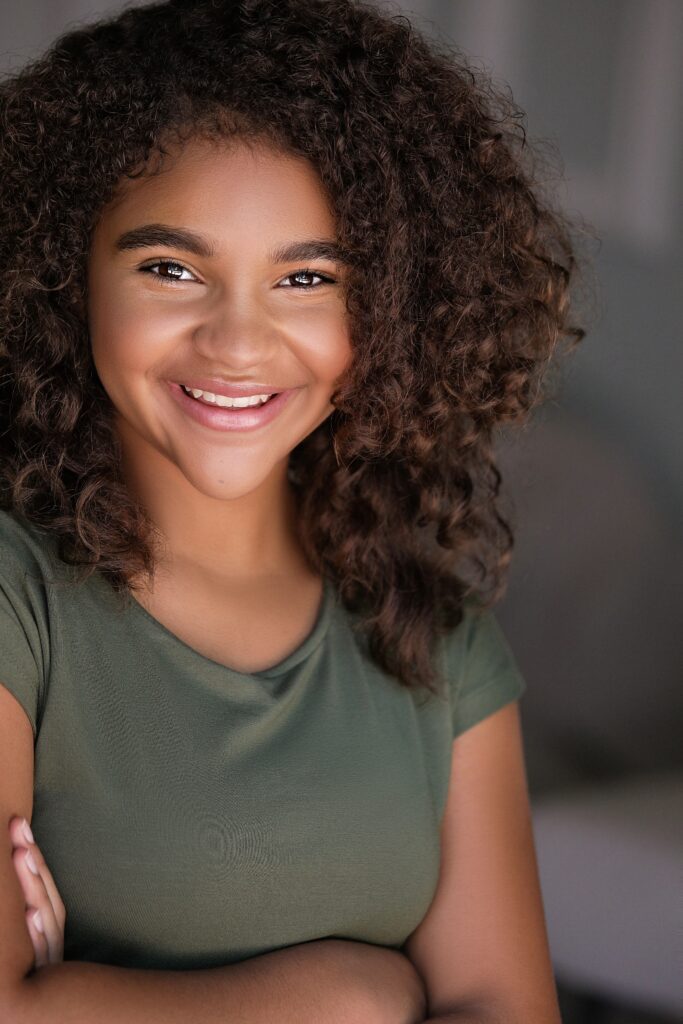 Kili Thompson, a young brunette girl wearing a green shirt
